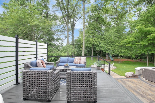 7313 Bromfield Dr, Canal Winchester, OH 43110 - deck featuring outdoor lounge area, a lawn, and view of wooded area