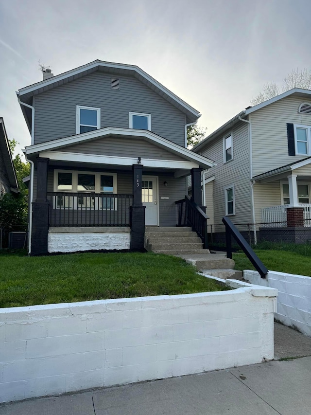 143 S Princeton Ave, Columbus, OH 43222 - view of front facade featuring a porch, a chimney, and a front yard