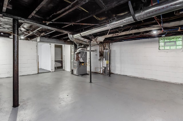 143 S Princeton Ave, Columbus, OH 43222 - basement with heating unit, water heater, and concrete block wall