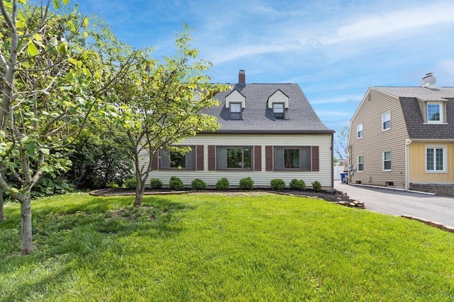 644 Eastmoor Blvd, Columbus, OH 43209 - new england style home featuring a front yard and a chimney