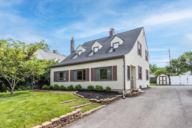644 Eastmoor Blvd, Columbus, OH 43209 - cape cod home featuring a chimney and asphalt driveway