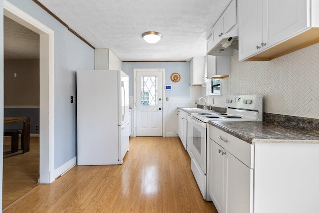 644 Eastmoor Blvd, Columbus, OH 43209 - kitchen with white appliances, range hood, a sink, light wood-type flooring, and dark countertops