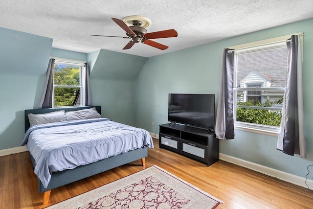 644 Eastmoor Blvd, Columbus, OH 43209 - bedroom featuring wood finished floors, baseboards, a textured ceiling, and a ceiling fan