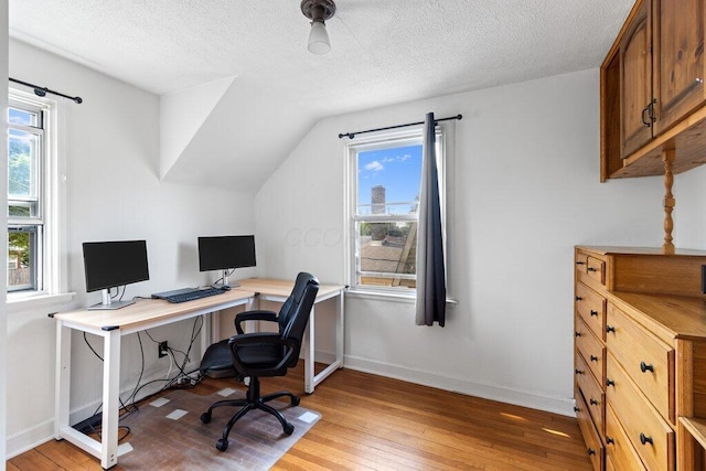 644 Eastmoor Blvd, Columbus, OH 43209 - office area featuring light wood-style floors, healthy amount of natural light, a textured ceiling, vaulted ceiling, and baseboards