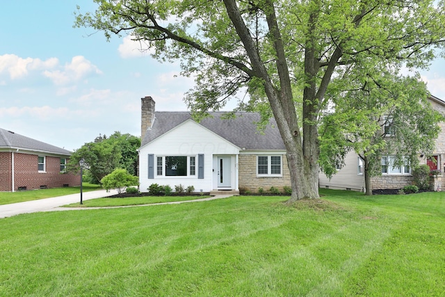 2009 Zollinger Rd, Columbus, OH 43221 - view of front of home featuring a chimney, stone siding, and a front yard