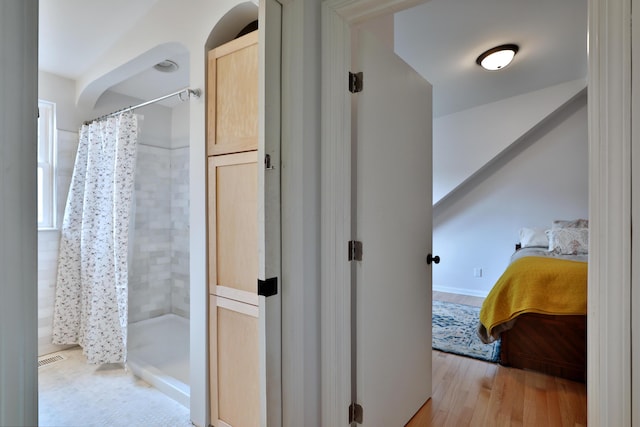 2009 Zollinger Rd, Columbus, OH 43221 - ensuite bathroom featuring tiled shower and wood finished floors