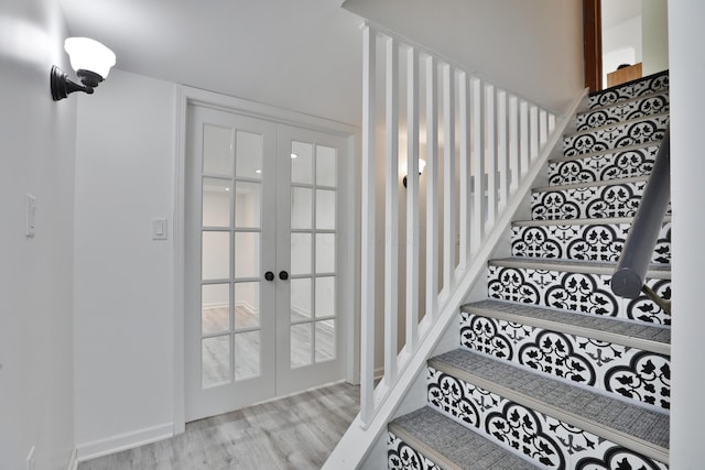 2009 Zollinger Rd, Columbus, OH 43221 - stairs with french doors and wood finished floors