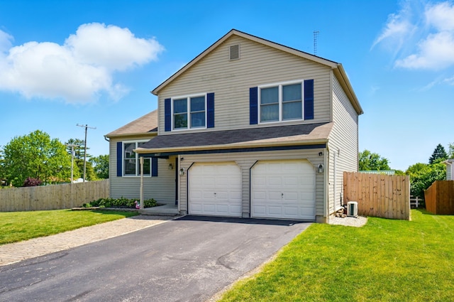 1627 Metcalfe Ave, Columbus, OH 43207 - view of front of home featuring a garage, asphalt driveway, and cooling unit