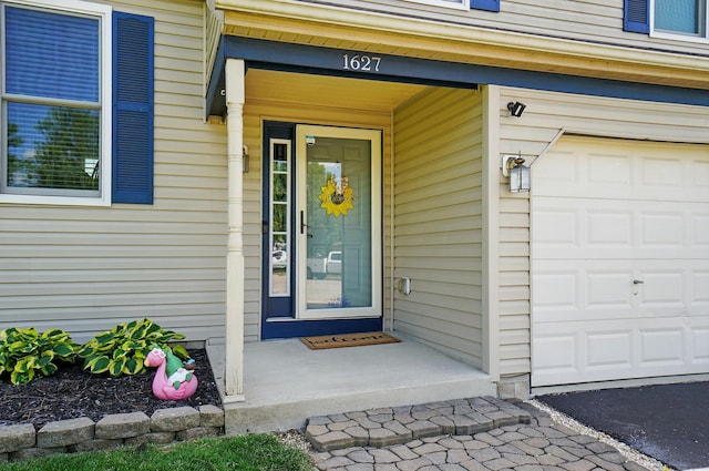 1627 Metcalfe Ave, Columbus, OH 43207 - doorway to property featuring an attached garage