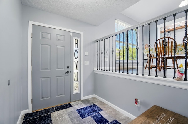1627 Metcalfe Ave, Columbus, OH 43207 - foyer entrance with baseboards and a textured ceiling