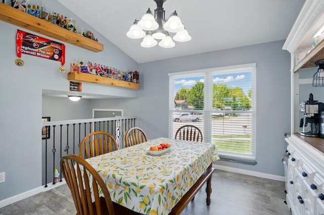 1627 Metcalfe Ave, Columbus, OH 43207 - dining area with a chandelier, healthy amount of natural light, wood finished floors, and vaulted ceiling