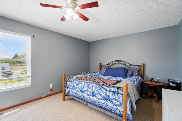 1627 Metcalfe Ave, Columbus, OH 43207 - bedroom featuring light colored carpet, ceiling fan, baseboards, and a textured ceiling