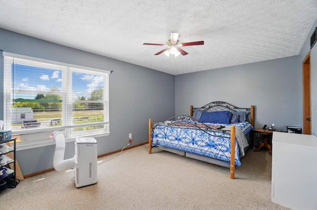 1627 Metcalfe Ave, Columbus, OH 43207 - bedroom with carpet floors, baseboards, ceiling fan, and a textured ceiling
