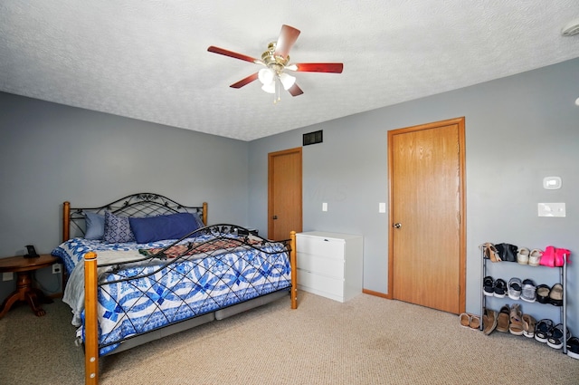 1627 Metcalfe Ave, Columbus, OH 43207 - bedroom with carpet flooring, ceiling fan, a textured ceiling, and baseboards