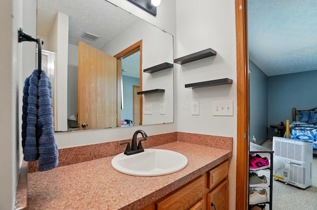 1627 Metcalfe Ave, Columbus, OH 43207 - bathroom with a textured ceiling and vanity