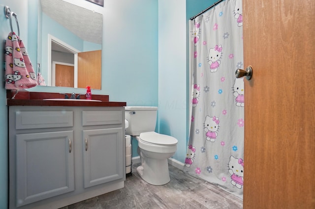 1627 Metcalfe Ave, Columbus, OH 43207 - bathroom with wood finished floors, toilet, vanity, and a shower with curtain