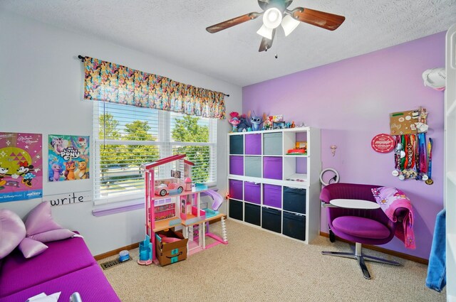 1627 Metcalfe Ave, Columbus, OH 43207 - game room with carpet, a textured ceiling, a ceiling fan, and baseboards