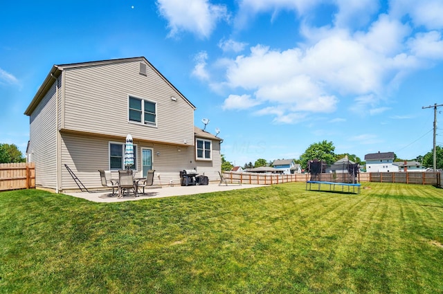 1627 Metcalfe Ave, Columbus, OH 43207 - rear view of property with a trampoline and a patio