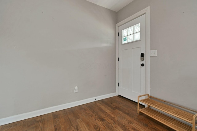 2567 Joyce Ave, Columbus, OH 43211 - foyer featuring dark wood finished floors and baseboards