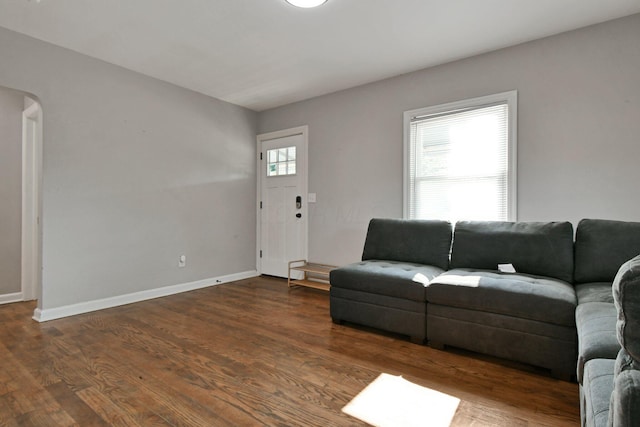 2567 Joyce Ave, Columbus, OH 43211 - living area with arched walkways, baseboards, and wood finished floors