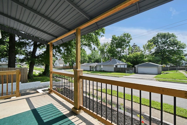2567 Joyce Ave, Columbus, OH 43211 - wooden deck featuring a garage, a residential view, and an outbuilding
