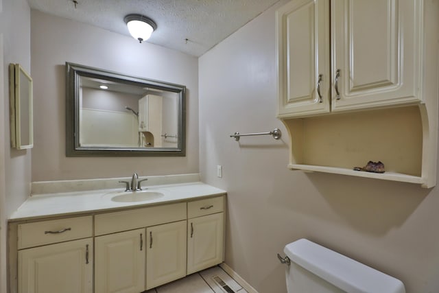 1390 E Dublin Granville Rd, Columbus, OH 43229 - bathroom featuring toilet, vanity, and a textured ceiling