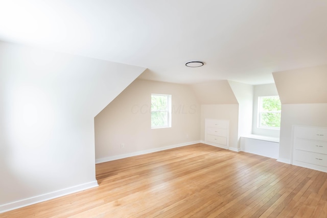109 E Home Rd, Springfield, OH 45504 - bonus room featuring lofted ceiling, light wood-type flooring, and baseboards