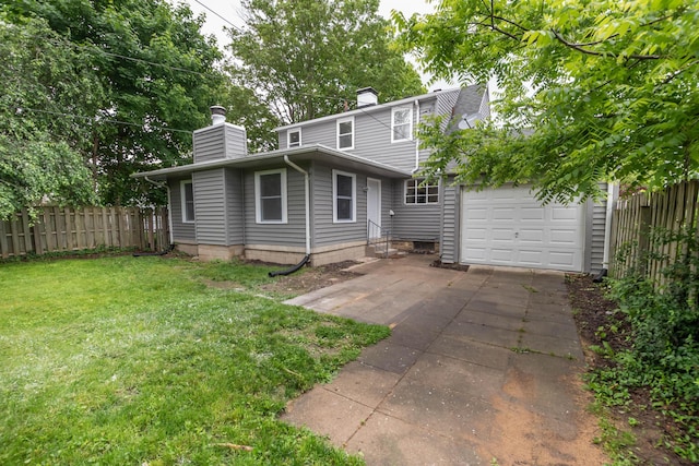 109 E Home Rd, Springfield, OH 45504 - view of front of house featuring a chimney, a garage, concrete driveway, and an outdoor structure