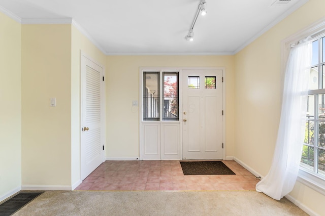 1631 Roxbury Rd Unit D2, Columbus, OH 43212 - carpeted entryway featuring ornamental molding and tile patterned flooring