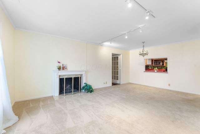 1631 Roxbury Rd Unit D2, Columbus, OH 43212 - unfurnished living room featuring track lighting, carpet floors, ornamental molding, and a fireplace