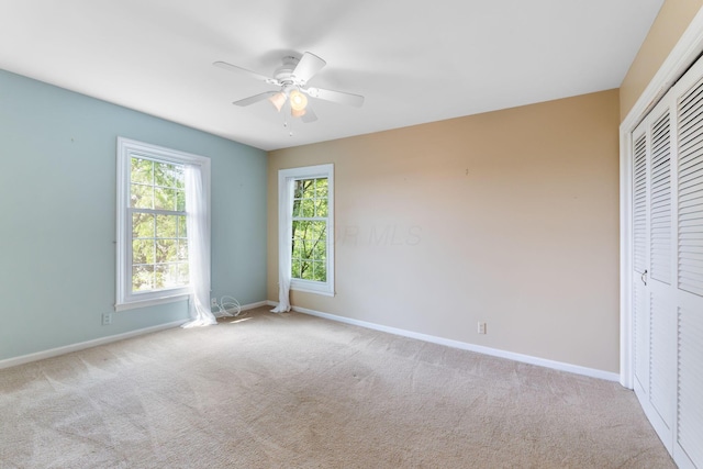 1631 Roxbury Rd Unit D2, Columbus, OH 43212 - unfurnished bedroom with carpet, a closet, and a ceiling fan