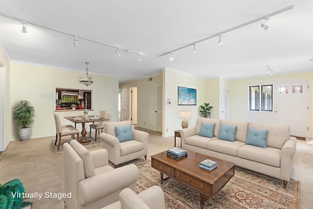1631 Roxbury Rd Unit D2, Columbus, OH 43212 - living area with track lighting, a chandelier, and light carpet