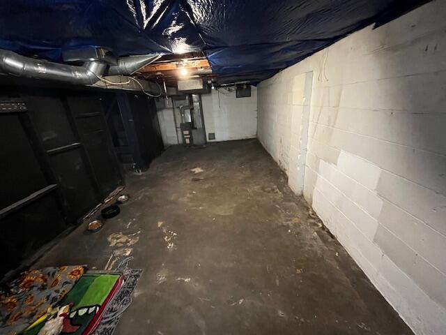 1231 E 23rd Ave, Columbus, OH 43211 - unfinished basement featuring concrete block wall and heating unit