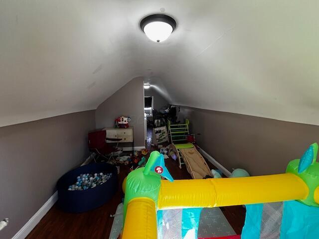 1231 E 23rd Ave, Columbus, OH 43211 - rec room featuring baseboards, vaulted ceiling, and wood finished floors