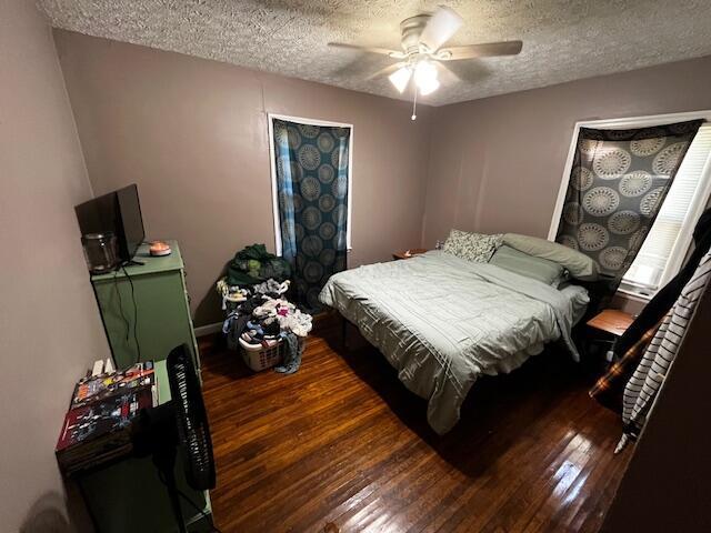 1231 E 23rd Ave, Columbus, OH 43211 - bedroom with a textured ceiling, hardwood / wood-style floors, and ceiling fan