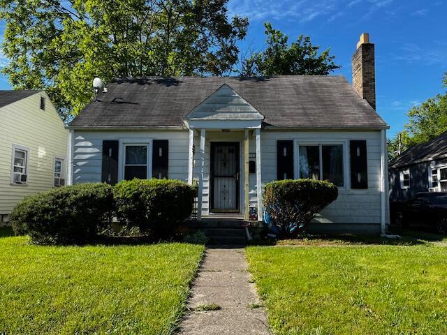 1231 E 23rd Ave, Columbus, OH 43211 - view of front of house featuring a front yard and a chimney