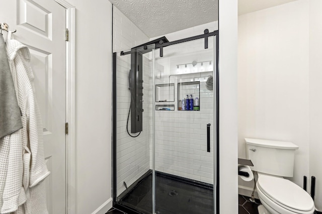 4006 Darby Park Rd, Hilliard, OH 43026 - bathroom with a shower stall, toilet, baseboards, and a textured ceiling