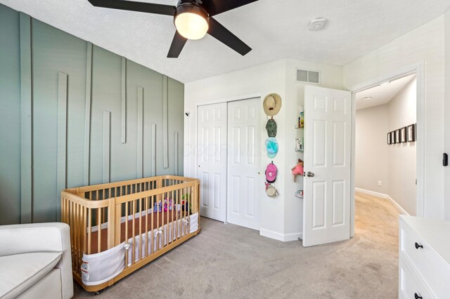 4006 Darby Park Rd, Hilliard, OH 43026 - bedroom featuring light colored carpet, a closet, baseboards, a ceiling fan, and a nursery area