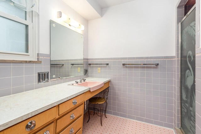 2772 Dale Ave, Columbus, OH 43209 - full bath featuring vanity, a stall shower, a wainscoted wall, and tile walls