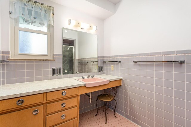 2772 Dale Ave, Columbus, OH 43209 - bathroom with a stall shower, a wainscoted wall, vanity, and tile walls