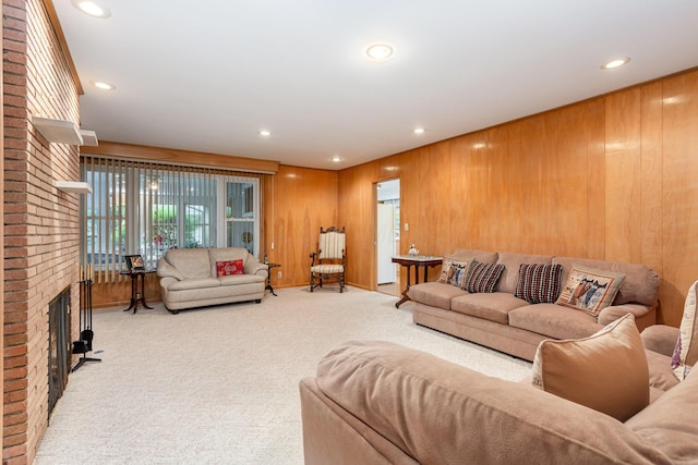 2772 Dale Ave, Columbus, OH 43209 - carpeted living room with wood walls, recessed lighting, and a brick fireplace