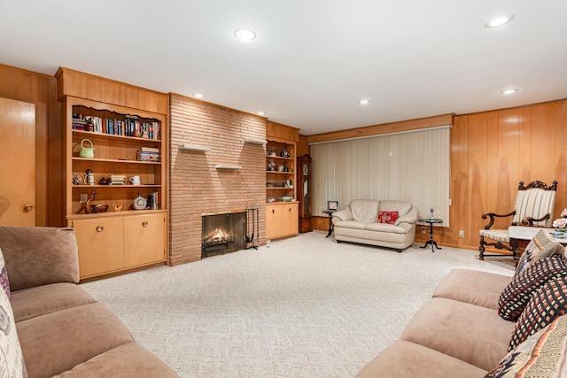 2772 Dale Ave, Columbus, OH 43209 - living area with carpet flooring, a fireplace, recessed lighting, wood walls, and built in shelves