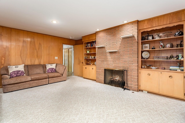 2772 Dale Ave, Columbus, OH 43209 - living room with light carpet, a fireplace, wooden walls, recessed lighting, and built in features