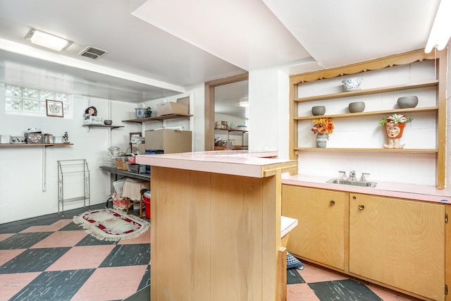2772 Dale Ave, Columbus, OH 43209 - kitchen featuring open shelves, a sink, light countertops, and light flooring