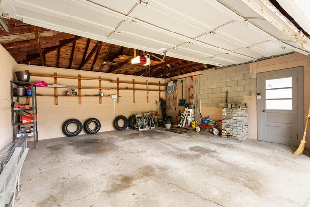 2772 Dale Ave, Columbus, OH 43209 - garage with a garage door opener and concrete block wall