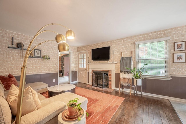 837 Cherry Bottom Rd, Columbus, OH 43230 - living area with wainscoting, a fireplace, plenty of natural light, wood-type flooring, and wood walls