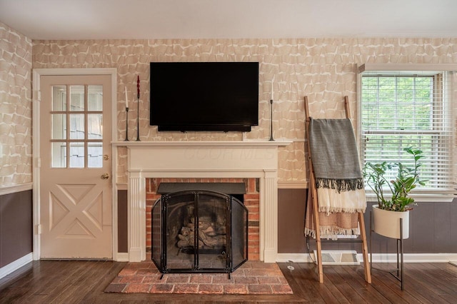 837 Cherry Bottom Rd, Columbus, OH 43230 - living area with wood finished floors, baseboards, and a brick fireplace