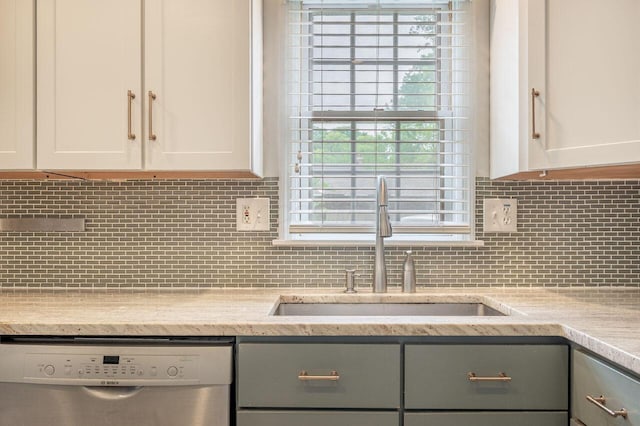 837 Cherry Bottom Rd, Columbus, OH 43230 - kitchen with dishwasher, a sink, tasteful backsplash, and white cabinetry