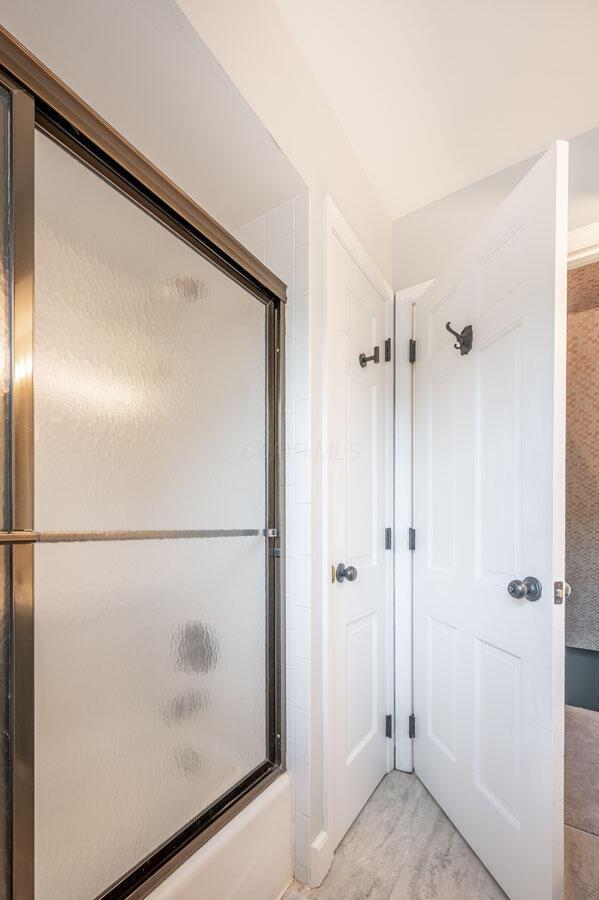837 Cherry Bottom Rd, Columbus, OH 43230 - bathroom featuring shower / bath combination with glass door