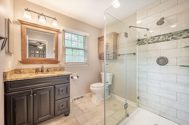 837 Cherry Bottom Rd, Columbus, OH 43230 - full bathroom with a stall shower, vanity, baseboards, and toilet